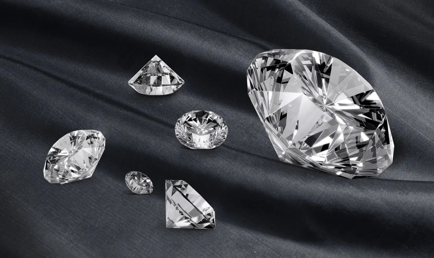 Polished natural diamonds on dark fabric